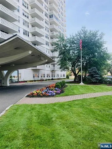 a front view of a building with garden