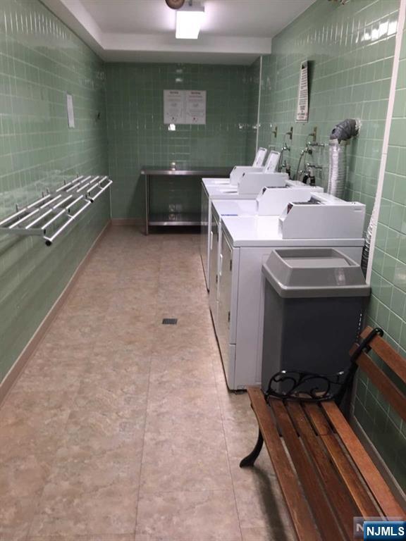 2000 Linwood Avenue, Unit 10M Fort Lee, NJ 07024 - Photo 22 of 28 a bathroom with a sink a toilet and a mirror