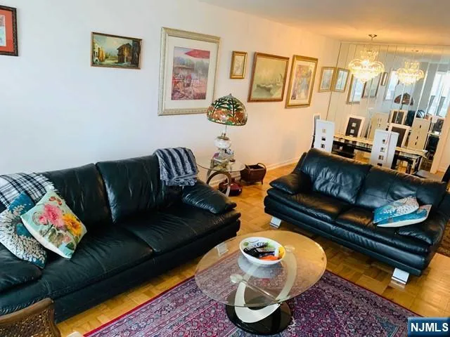 a living room with furniture and a rug