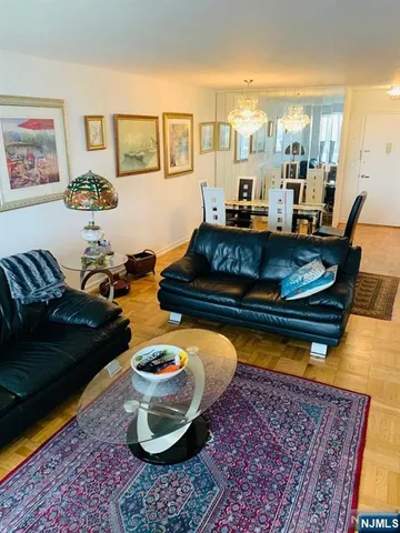 a living room with furniture and a rug