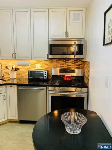 a kitchen with a stove and a microwave