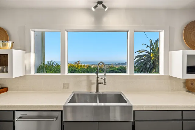 a kitchen with a sink and a window