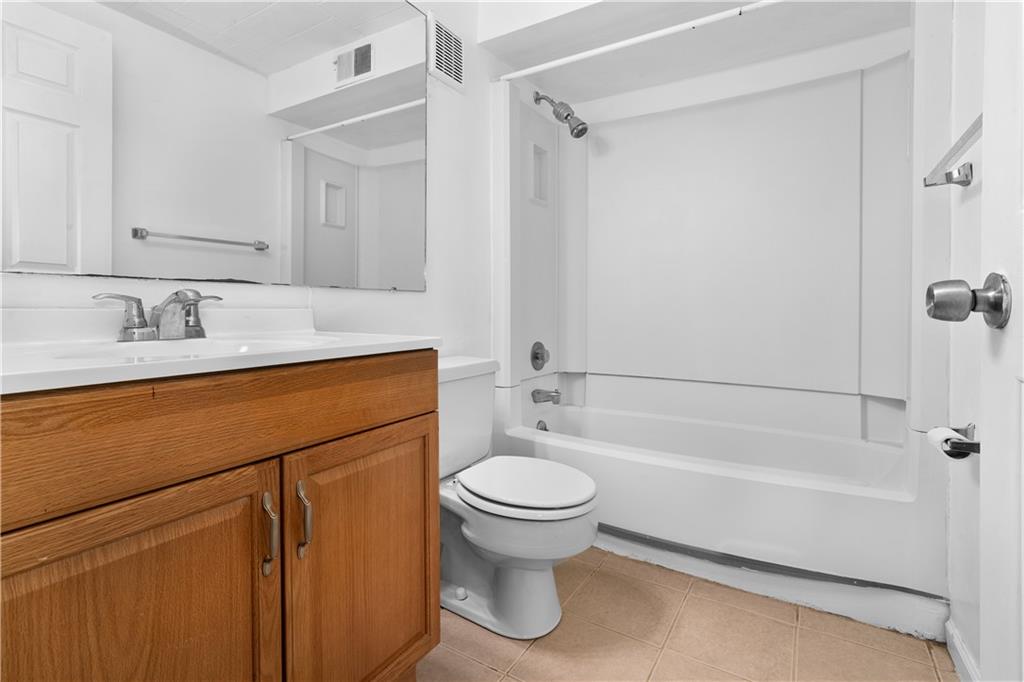 321 Ridge Point Circle, Unit B12 Bridgeville, PA 15017 - Photo 12 of 26 a bathroom with a sink a toilet and a bathtub