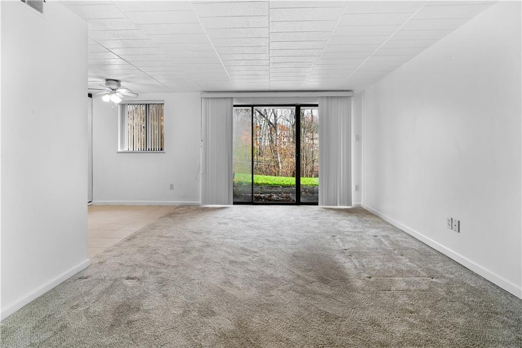 321 Ridge Point Circle, Unit B12 Bridgeville, PA 15017 - Photo 5 of 26 a view of an empty room with a window