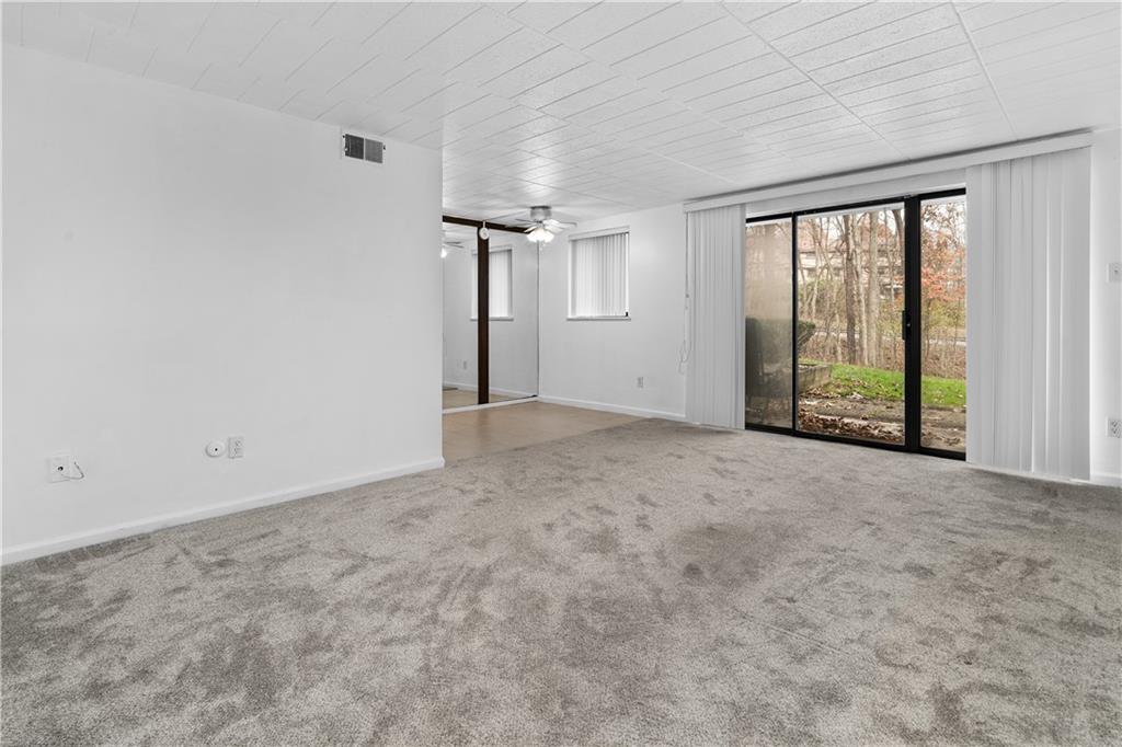 321 Ridge Point Circle, Unit B12 Bridgeville, PA 15017 - Photo 6 of 26 an empty room with windows