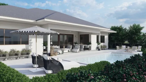 a view of a patio with dining table and chairs under an umbrella