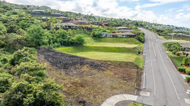 a view of a garden with an ocean