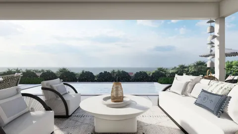 a view of a terrace with couches and sky view
