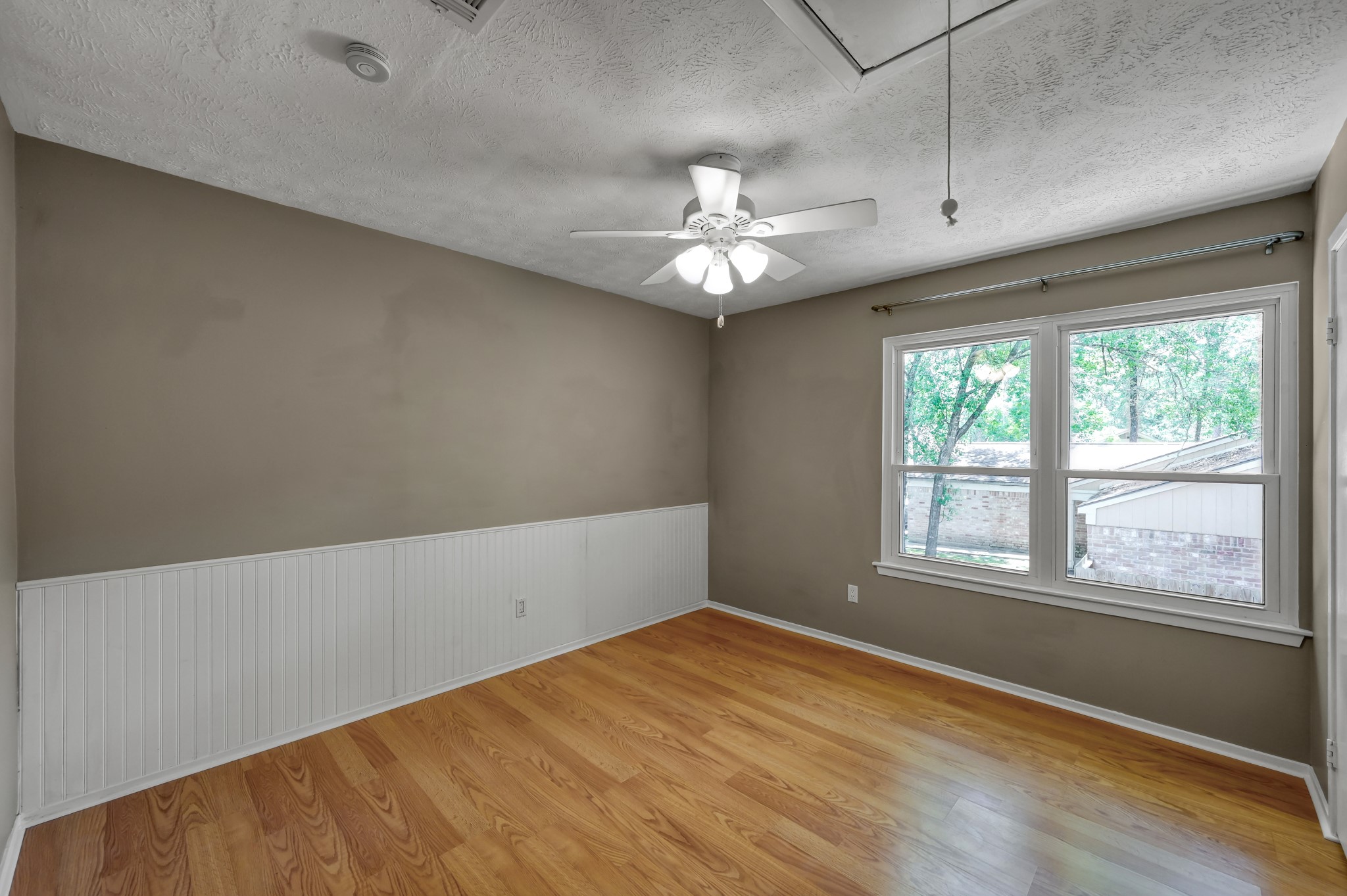 12224 Gun Oak Place Spring, TX 77380 - Photo 15 of 37 Bright Secondary Bedroom Overlooking the Mature Trees