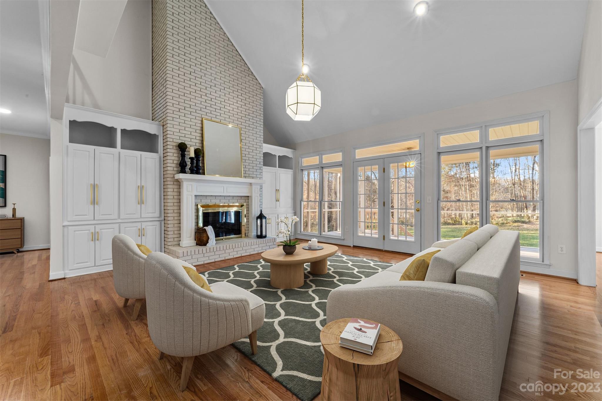 5476 Deer Run Court Davidson, NC 28036 - Photo 1 of 48 a living room with furniture fireplace and a large window