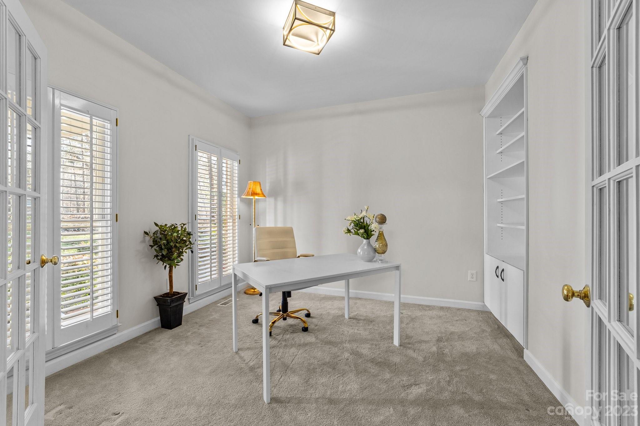 5476 Deer Run Court Davidson, NC 28036 - Photo 11 of 48 a view of a workspace with furniture and a window
