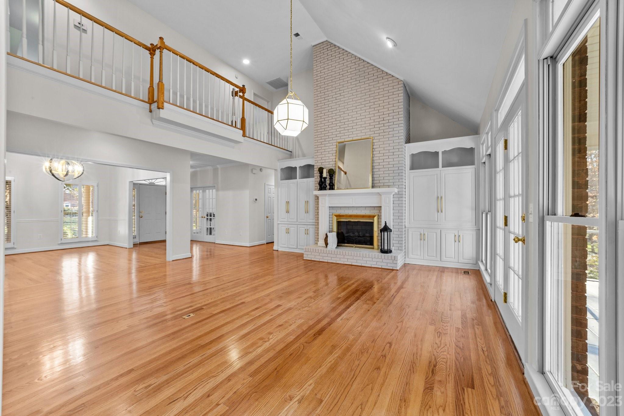 5476 Deer Run Court Davidson, NC 28036 - Photo 14 of 48 a view of livingroom with hardwood floor and a ceiling fan