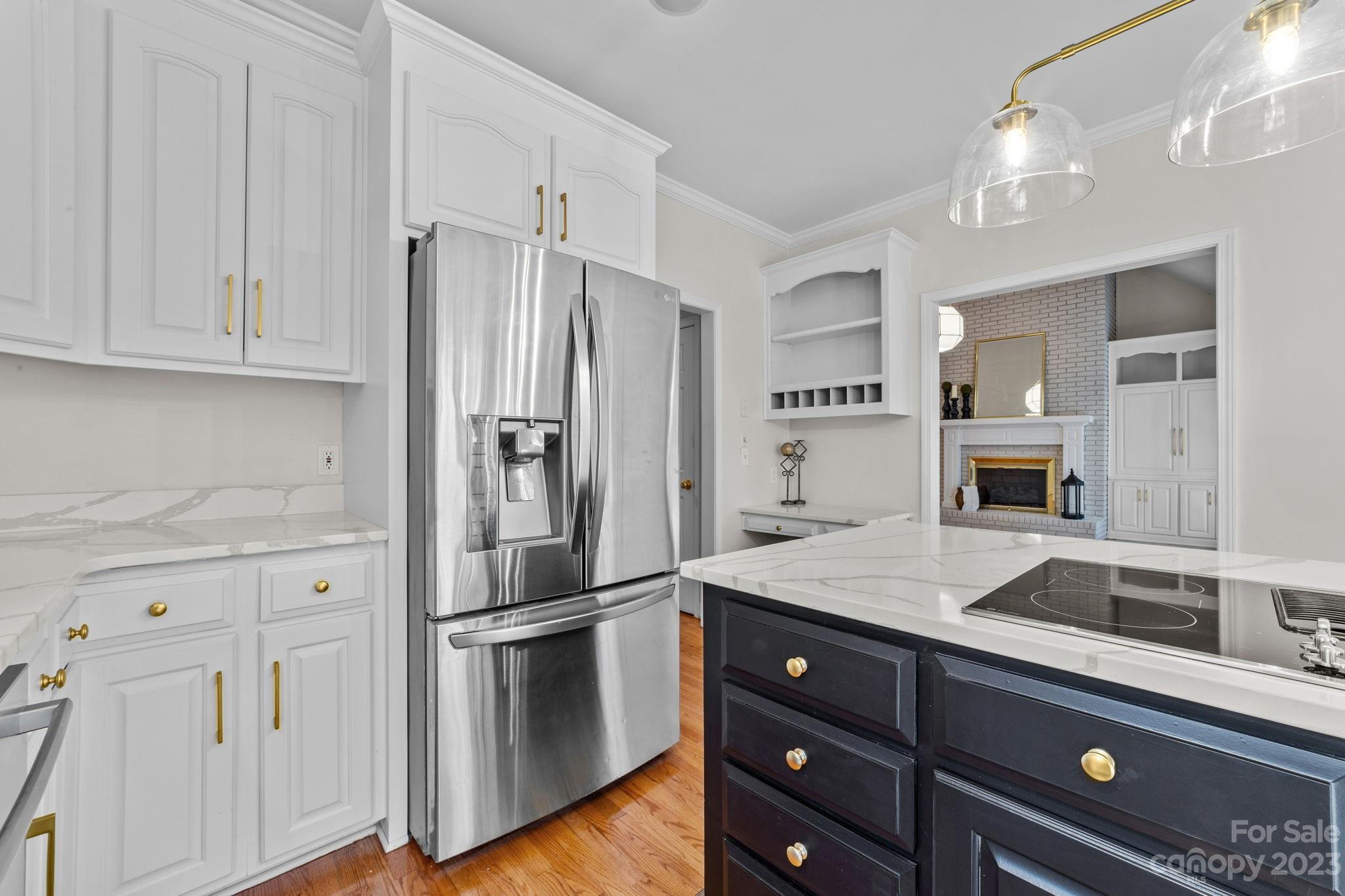 5476 Deer Run Court Davidson, NC 28036 - Photo 22 of 48 a kitchen with a refrigerator and a sink