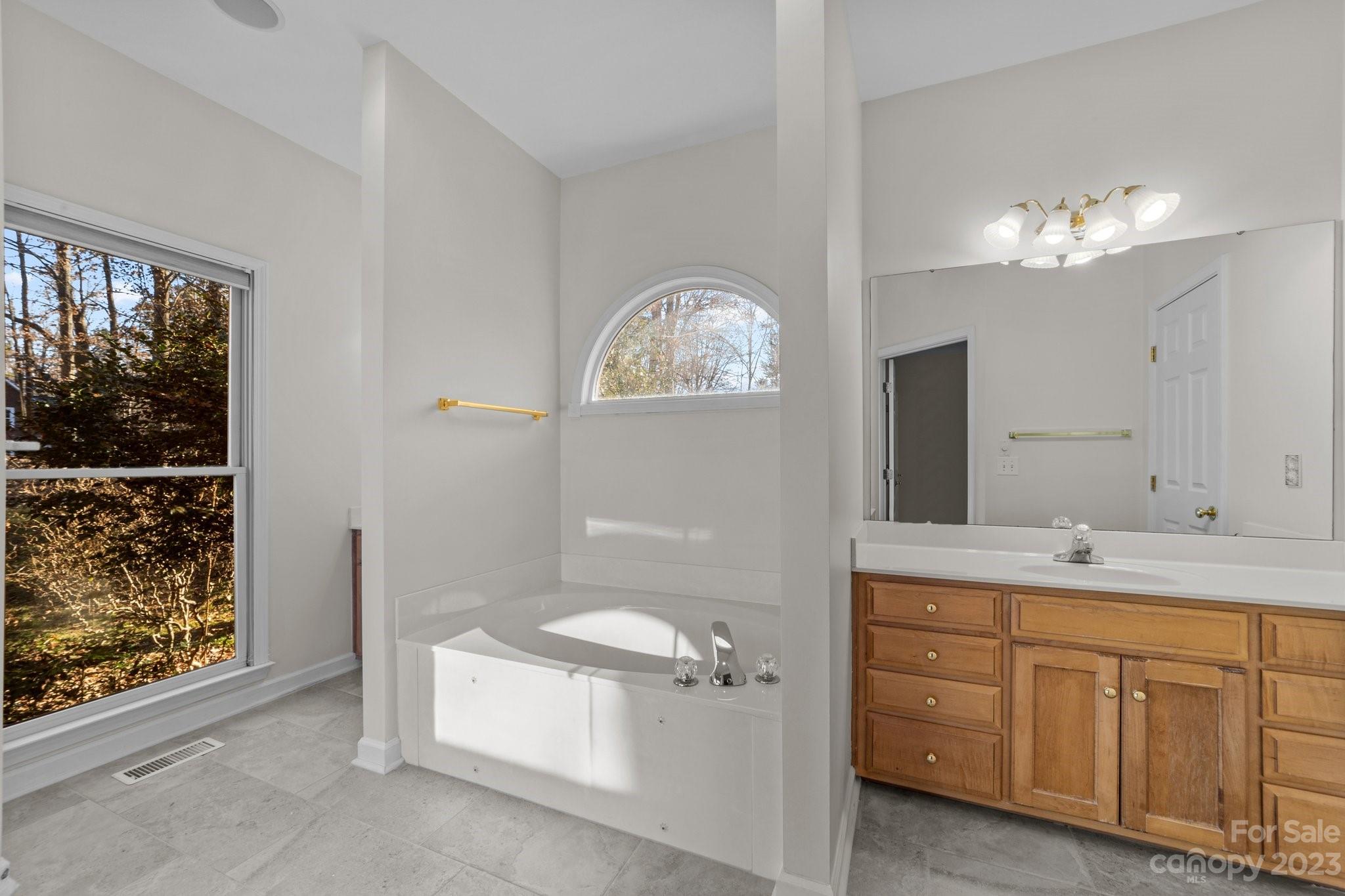 5476 Deer Run Court Davidson, NC 28036 - Photo 32 of 48 a bathroom with a toilet sink and mirror