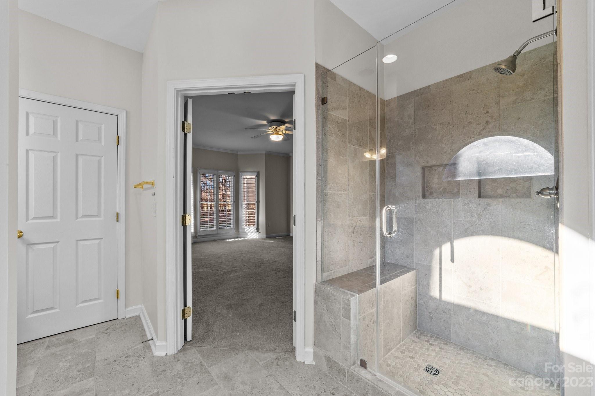 5476 Deer Run Court Davidson, NC 28036 - Photo 33 of 48 a bathroom with a tub shower and sink