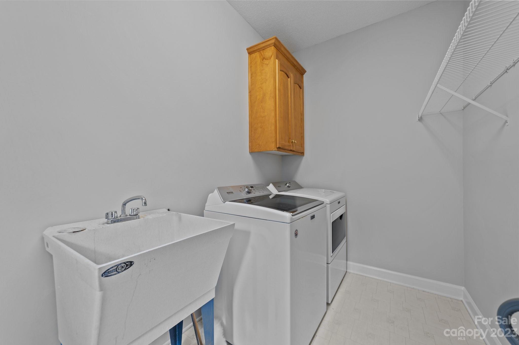 5476 Deer Run Court Davidson, NC 28036 - Photo 34 of 48 a utility room with dryer and washer