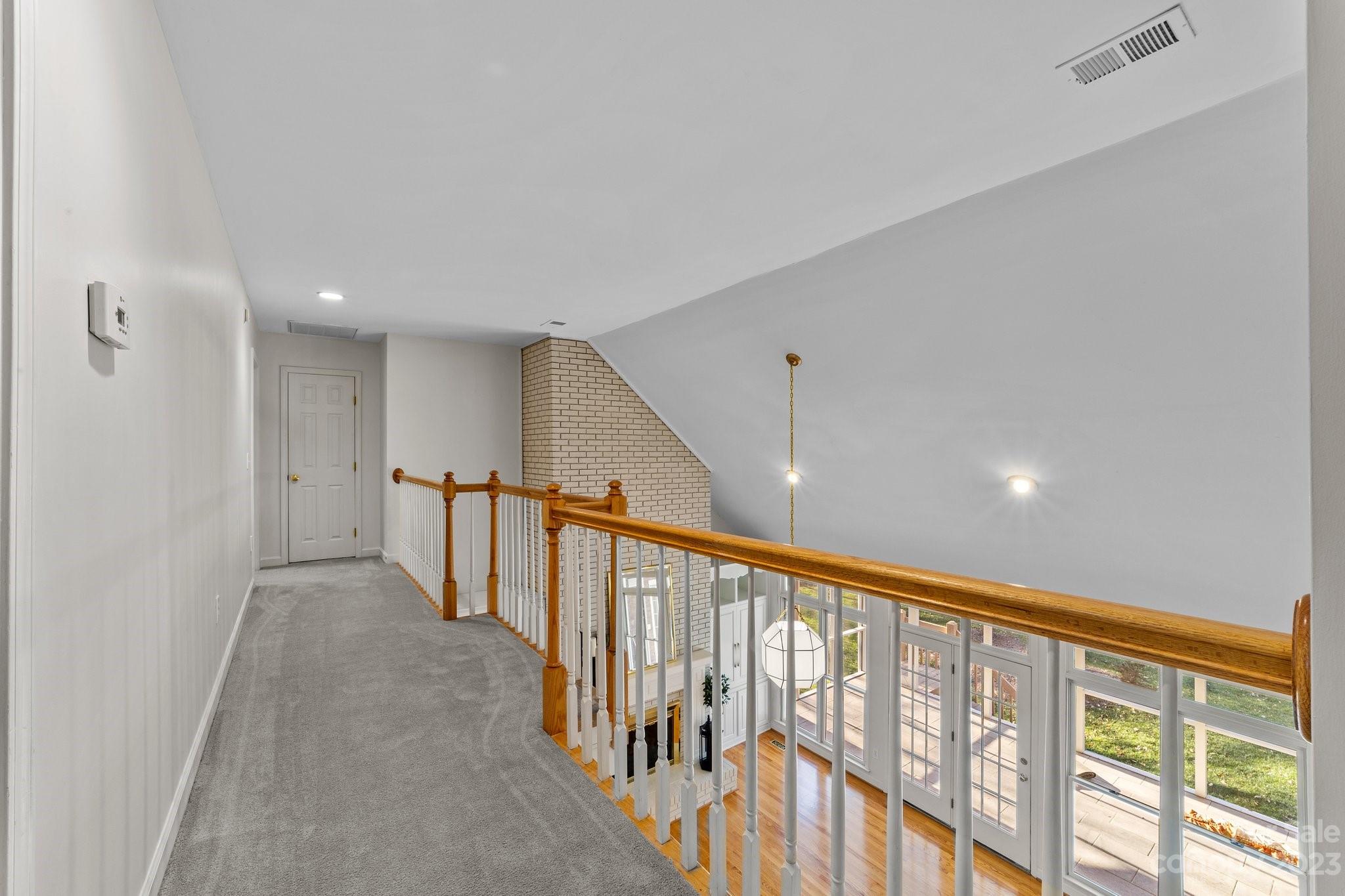 5476 Deer Run Court Davidson, NC 28036 - Photo 36 of 48 a view of hallway with stairs