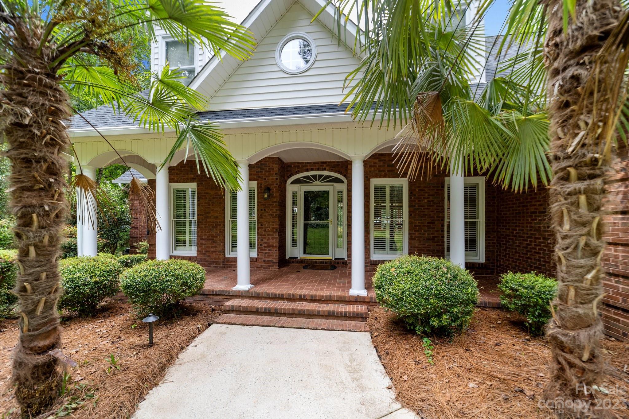 5476 Deer Run Court Davidson, NC 28036 - Photo 4 of 48 a front view of a house with garden