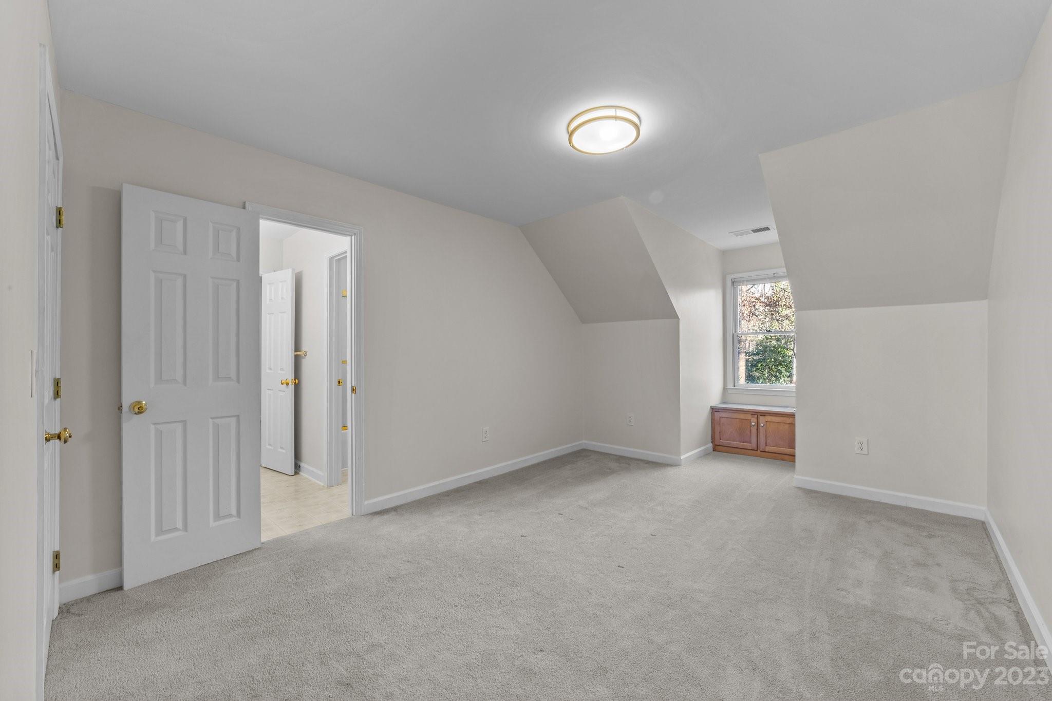 5476 Deer Run Court Davidson, NC 28036 - Photo 42 of 48 a view of an empty room with a window