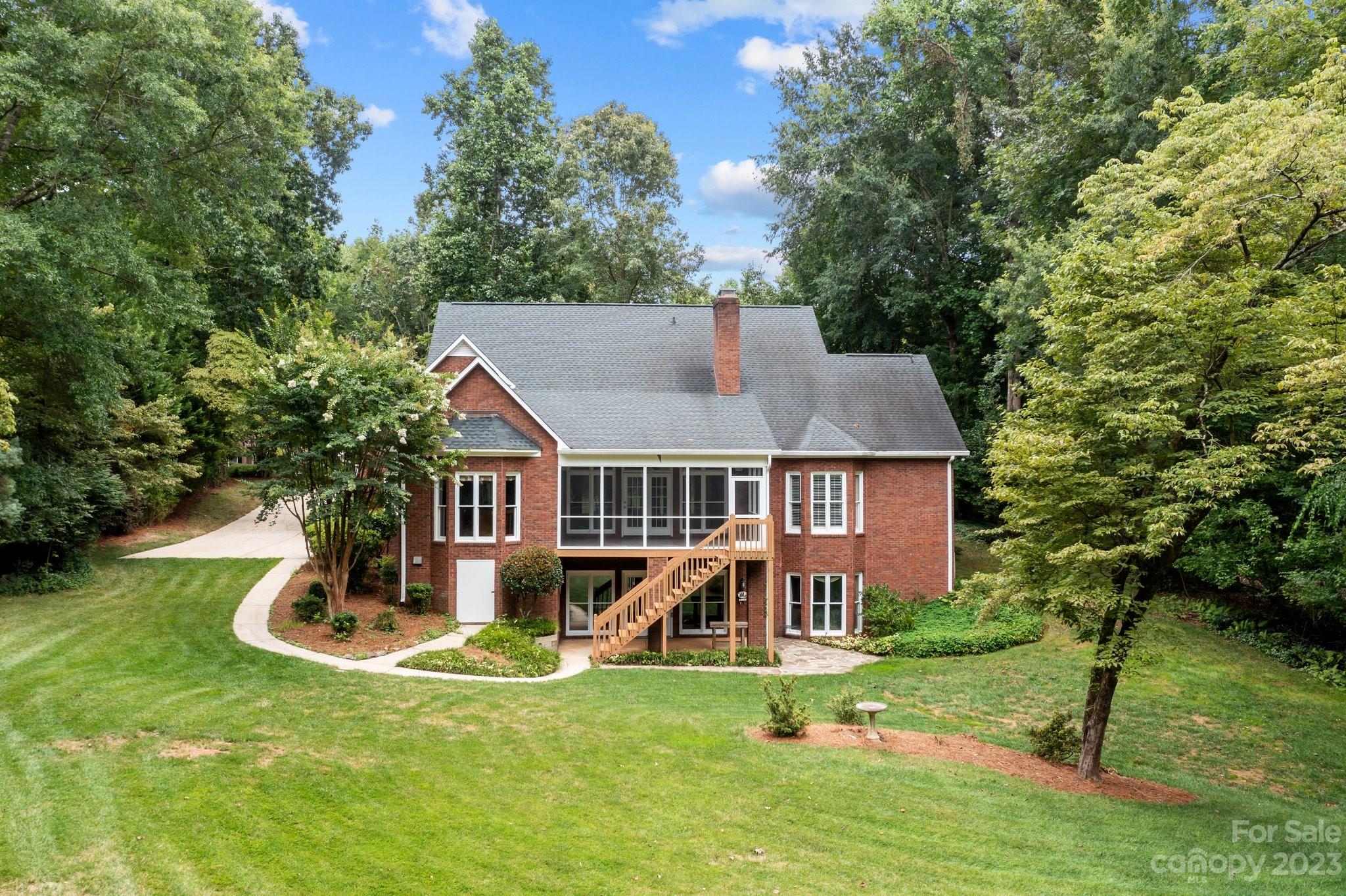 5476 Deer Run Court Davidson, NC 28036 - Photo 7 of 48 front view of a house with a yard