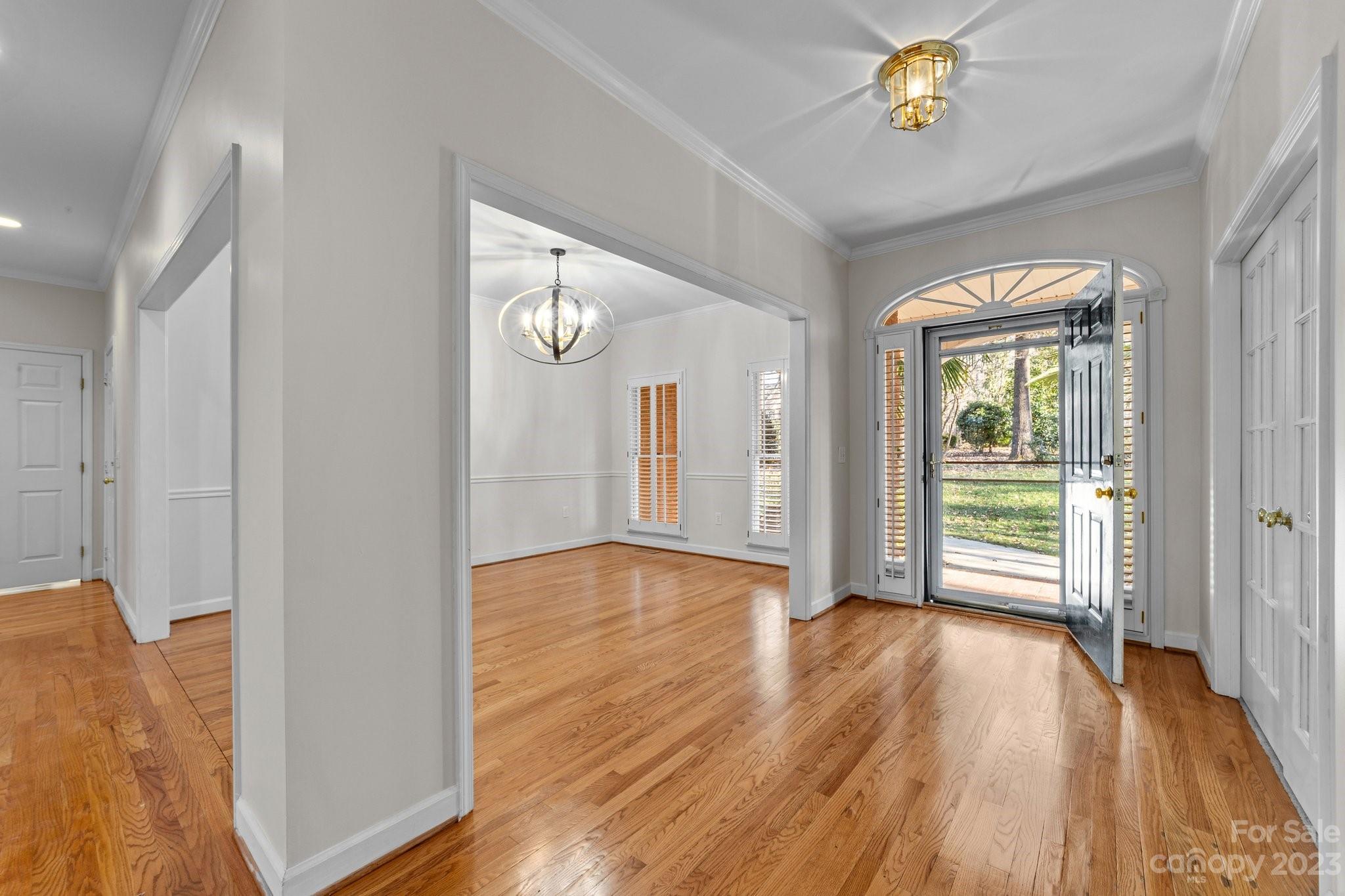5476 Deer Run Court Davidson, NC 28036 - Photo 10 of 48 a view of empty room with wooden floor and fan