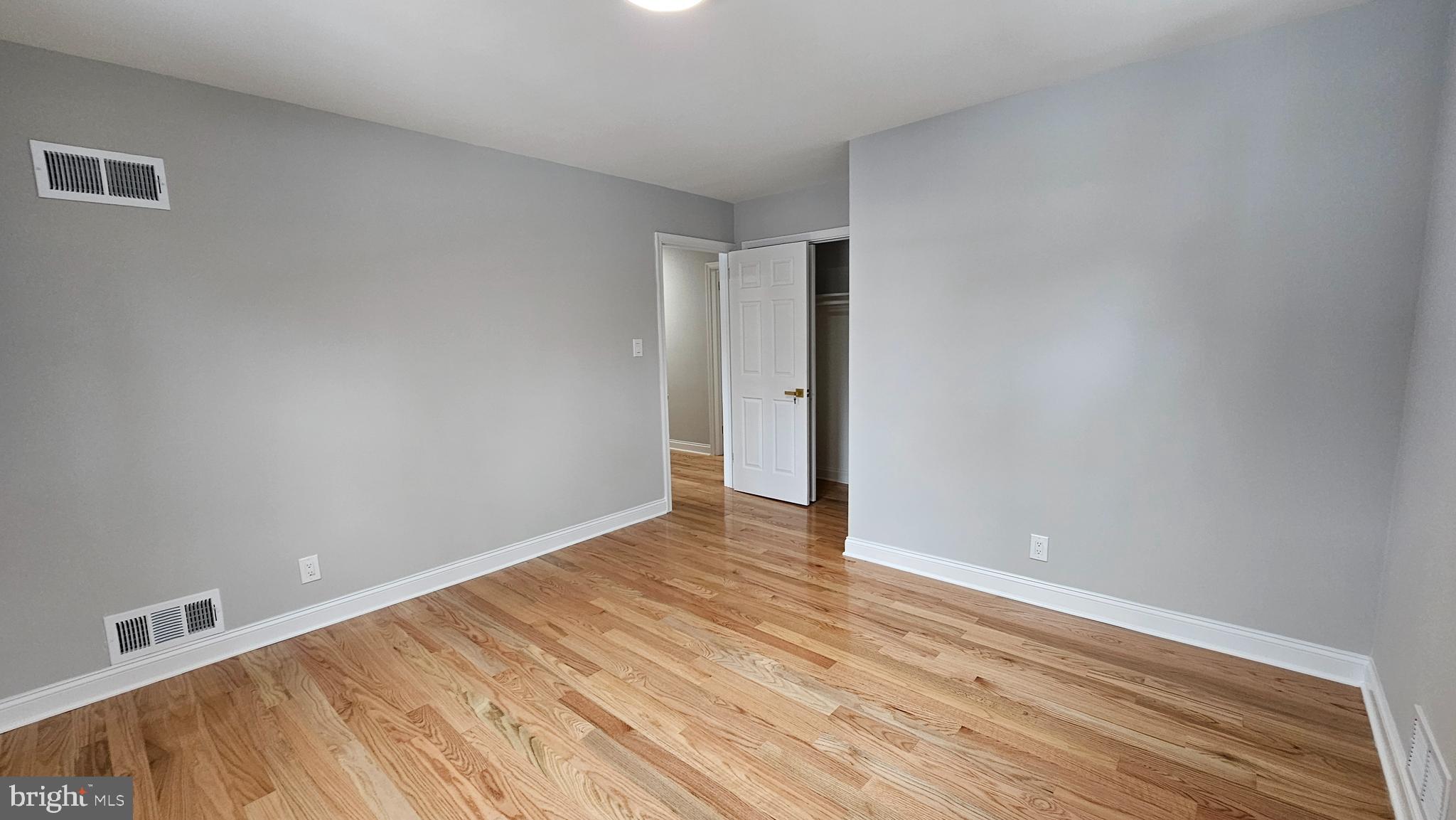 1305 Woodside Parkway Silver Spring, MD 20910 - Photo 20 of 41 a view of an empty room with wooden floor
