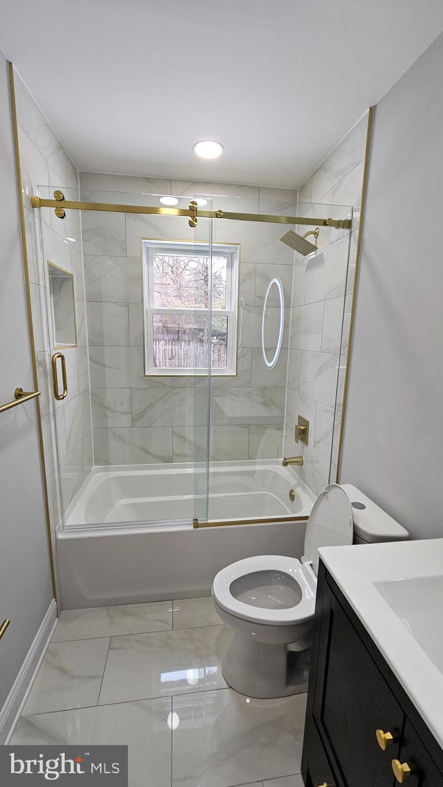 1305 Woodside Parkway Silver Spring, MD 20910 - Photo 22 of 41 a bathroom with a sink a toilet and a bathtub