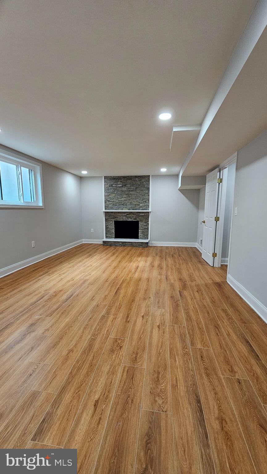1305 Woodside Parkway Silver Spring, MD 20910 - Photo 25 of 41 a view of empty room with wooden floor and fireplace