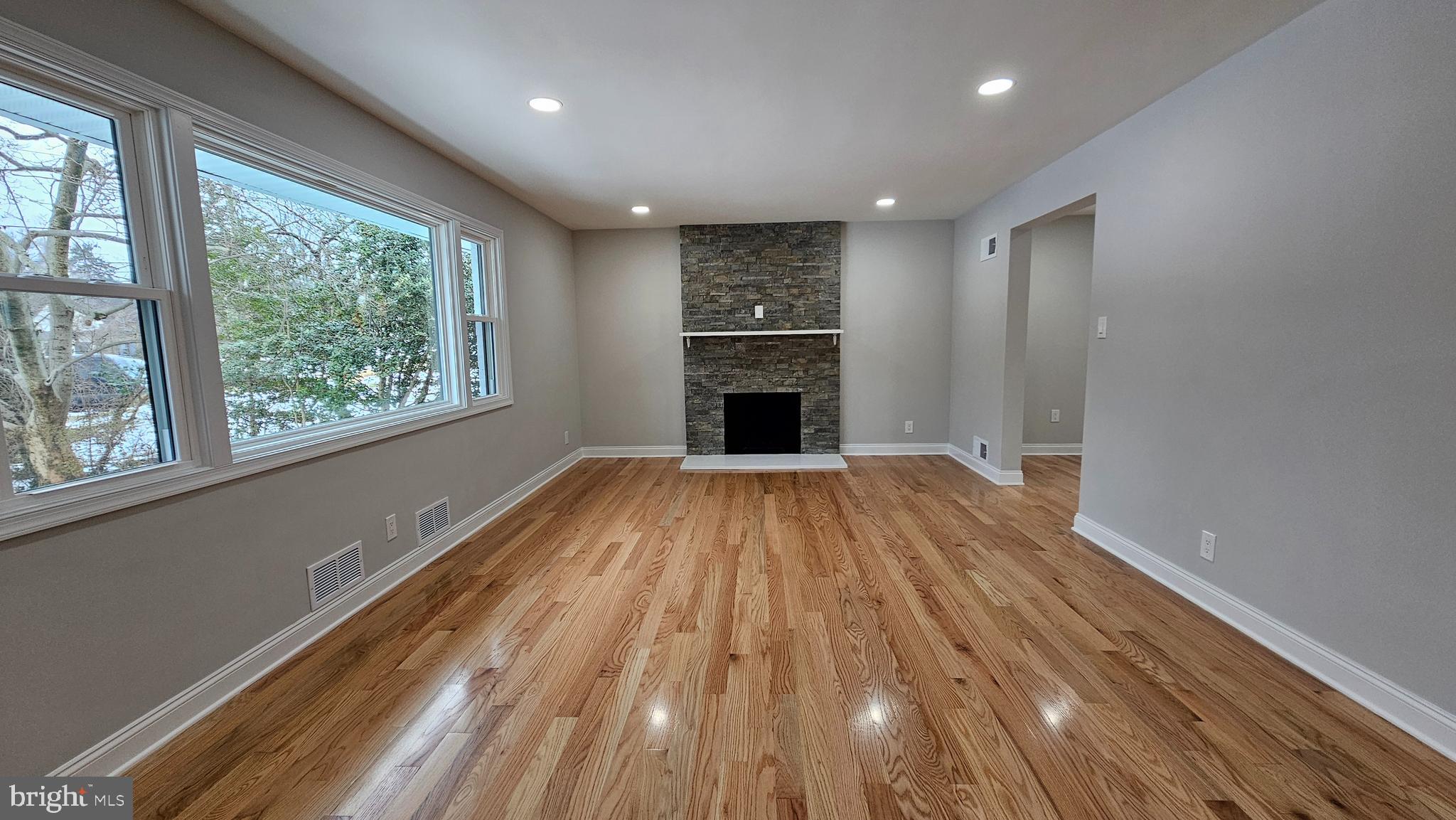 1305 Woodside Parkway Silver Spring, MD 20910 - Photo 3 of 41 a view of an empty room with wooden floor and a window