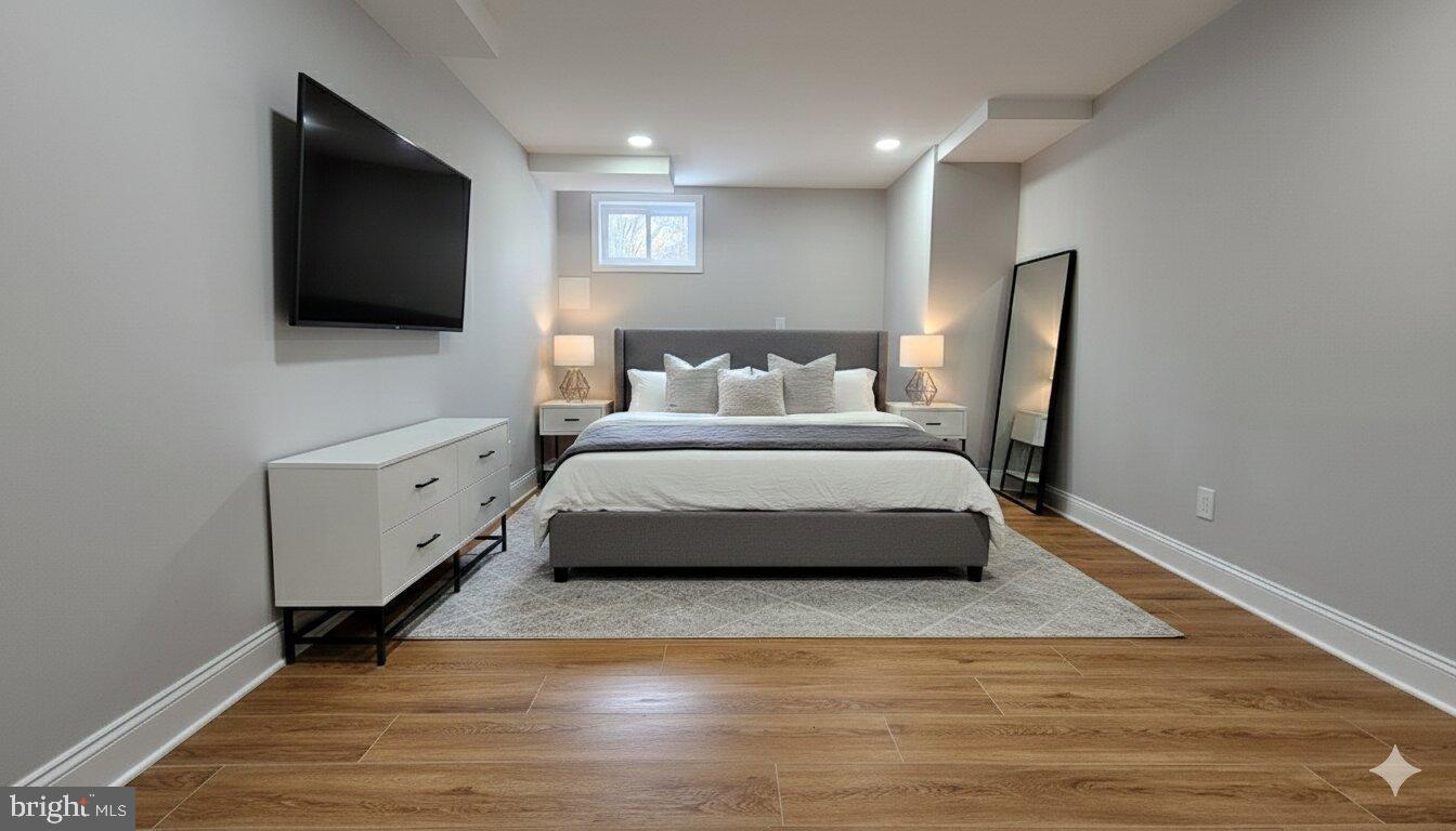 1305 Woodside Parkway Silver Spring, MD 20910 - Photo 31 of 41 a spacious bedroom with a bed and a flat screen tv