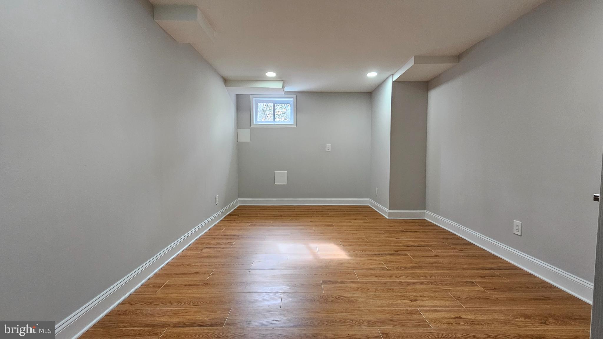 1305 Woodside Parkway Silver Spring, MD 20910 - Photo 32 of 41 a view of empty room with wooden floor