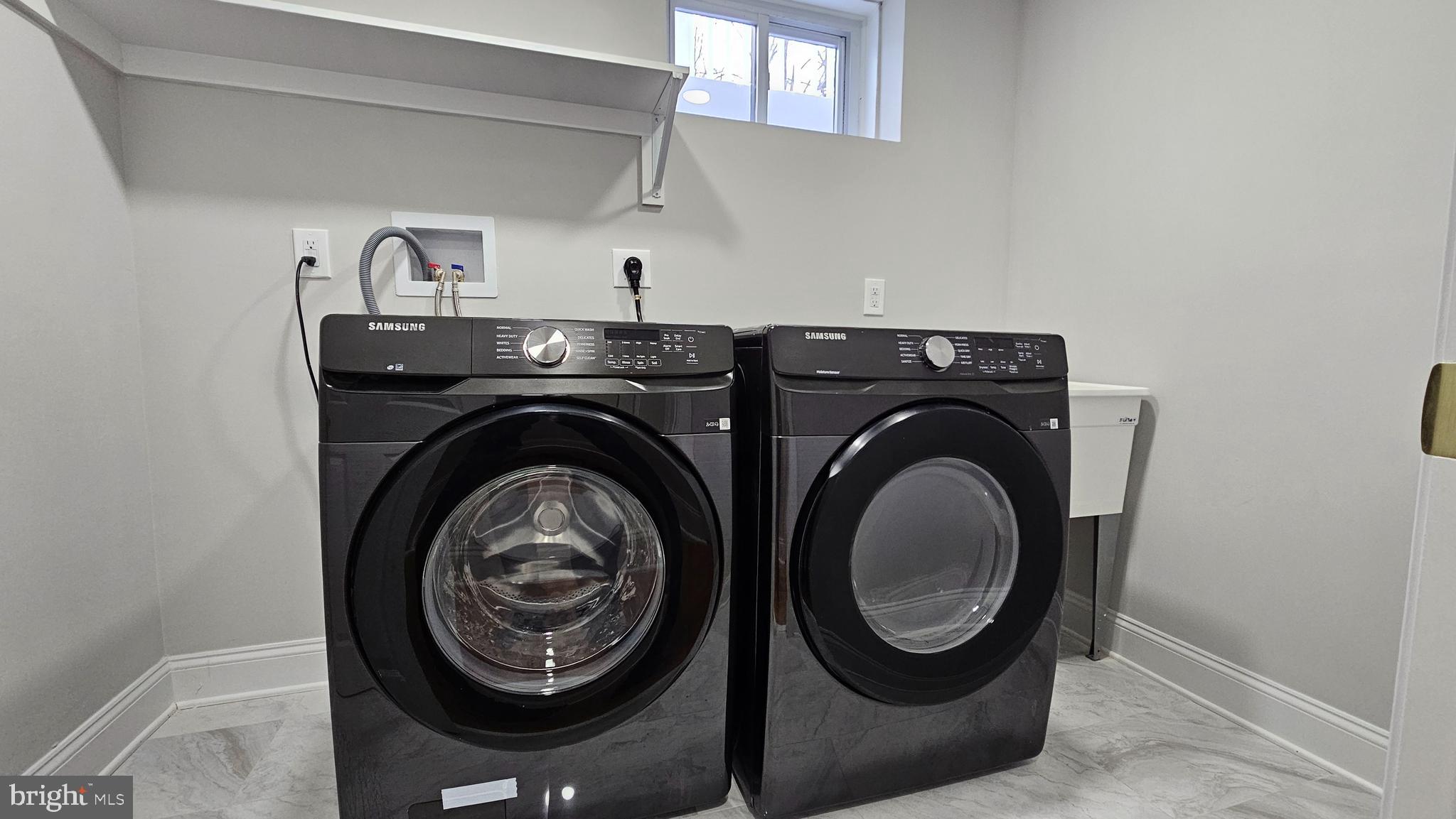 1305 Woodside Parkway Silver Spring, MD 20910 - Photo 36 of 41 a utility room with dryer and washer