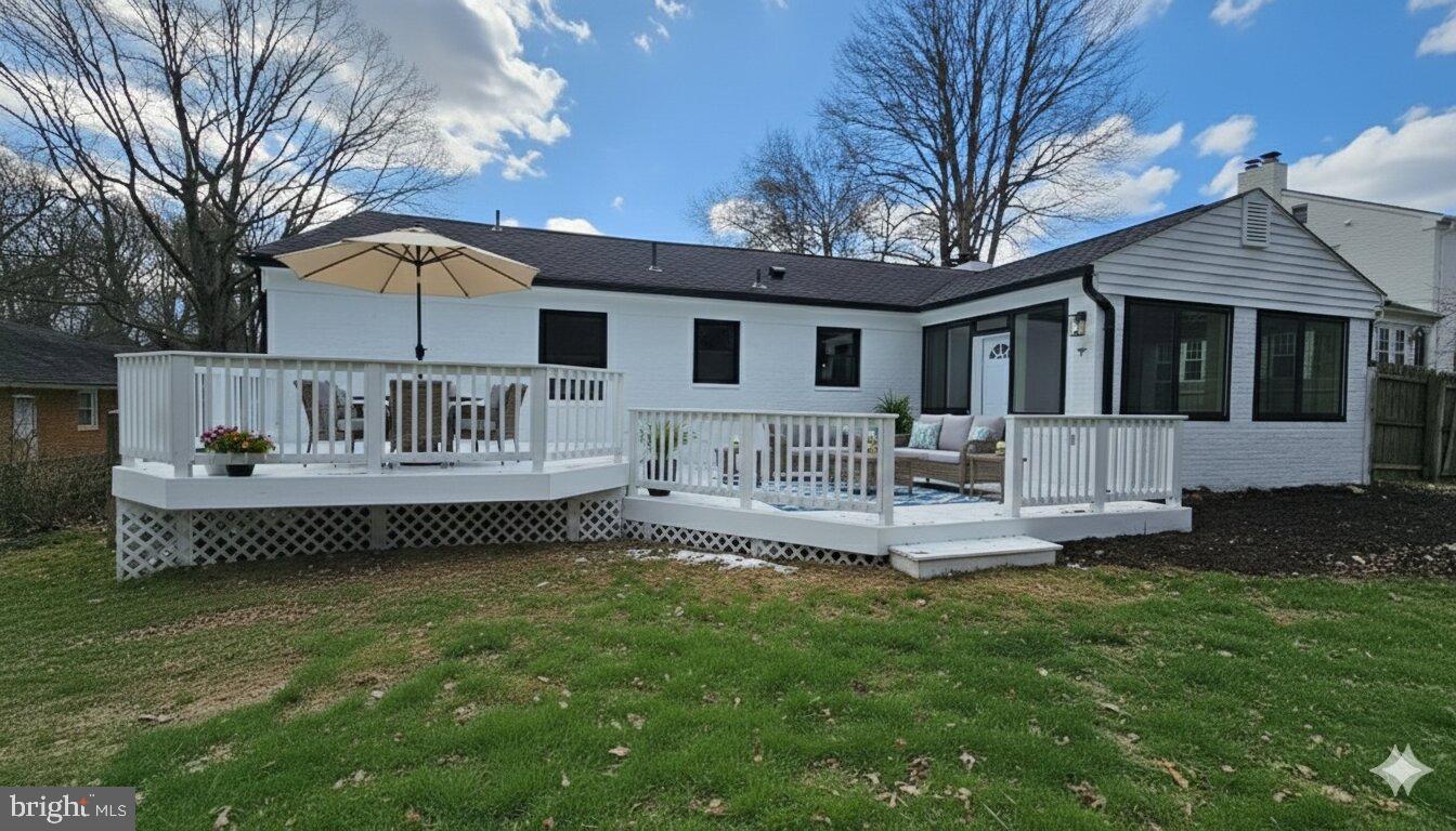 1305 Woodside Parkway Silver Spring, MD 20910 - Photo 40 of 41 a front view of a house with a garden and patio