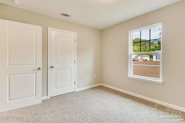 an empty room with a ceiling fan and a ceiling fan