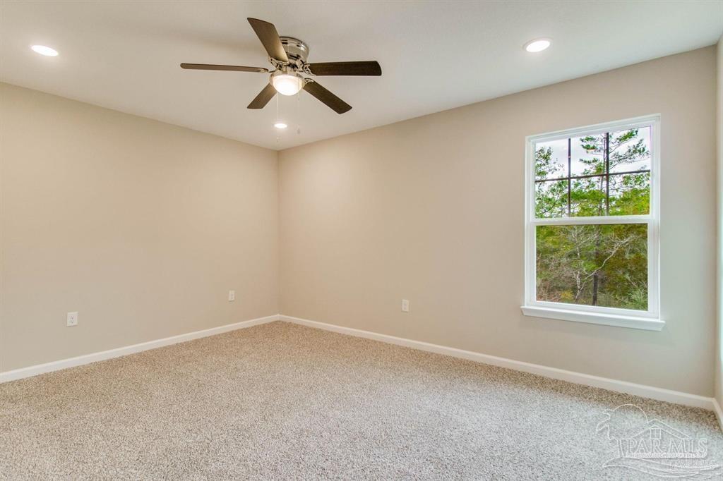 5601 Riviera Drive Milton, FL 32583 - Photo 10 of 18 an empty room with a window