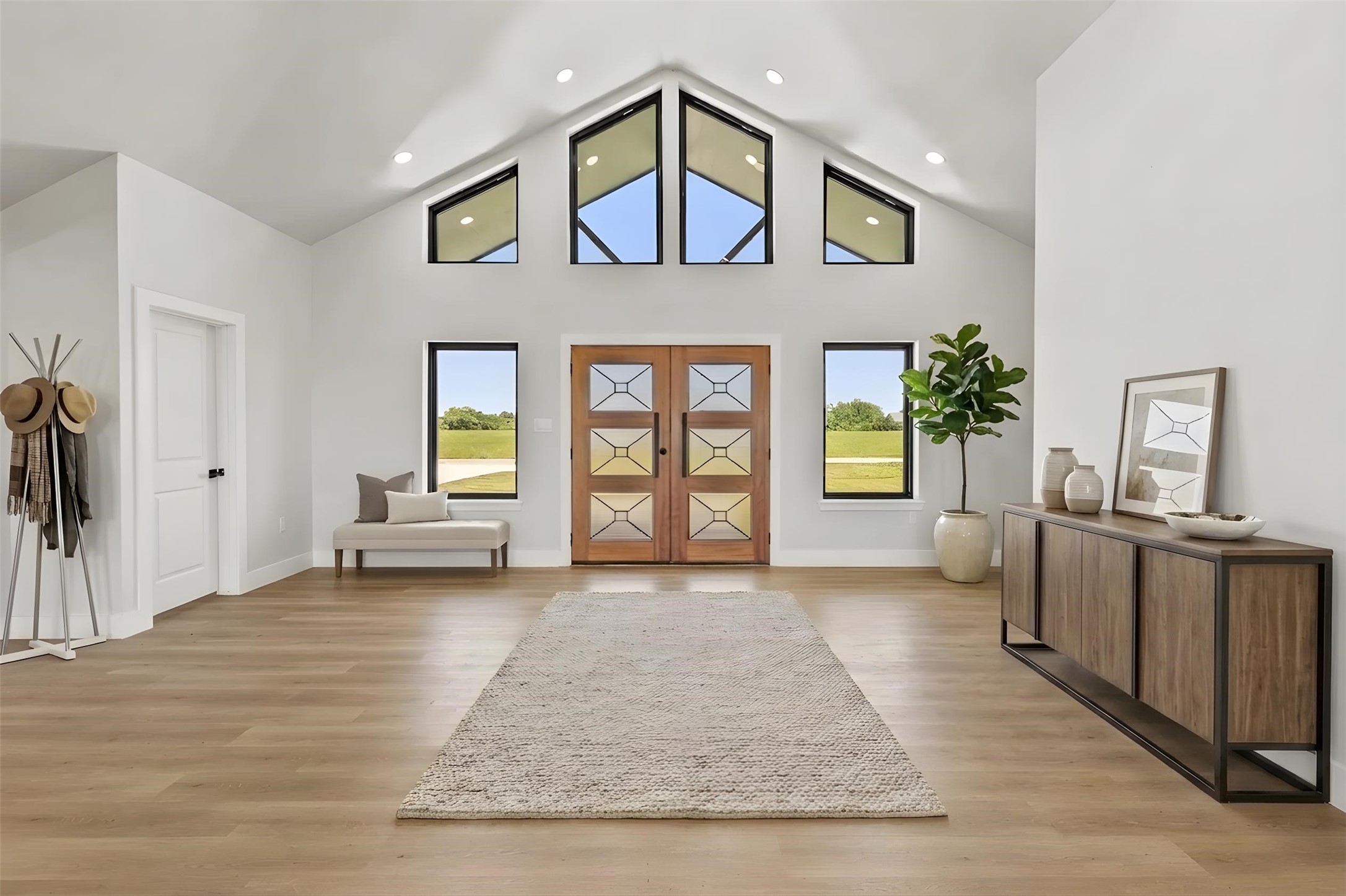 619 Chuckwagon Trail Angleton, TX 77515 - Photo 3 of 37 Spacious North facing entry welcomes you inside, while abundant windows fill the home with natural light throughout the day. Virtually staged. Furniture and décor shown are for illustrative purposes only.