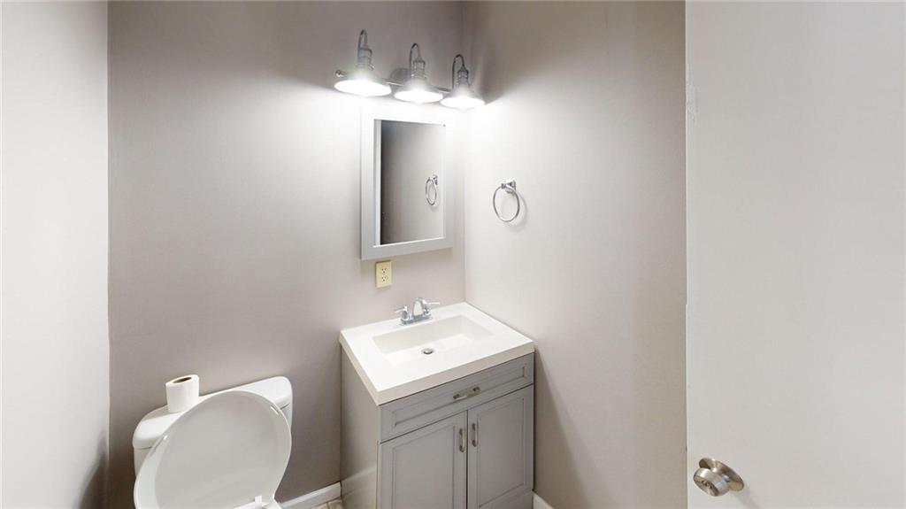 188 Reiber Road Renfrew, PA 16053 - Photo 14 of 38 a bathroom with a sink mirror and vanity