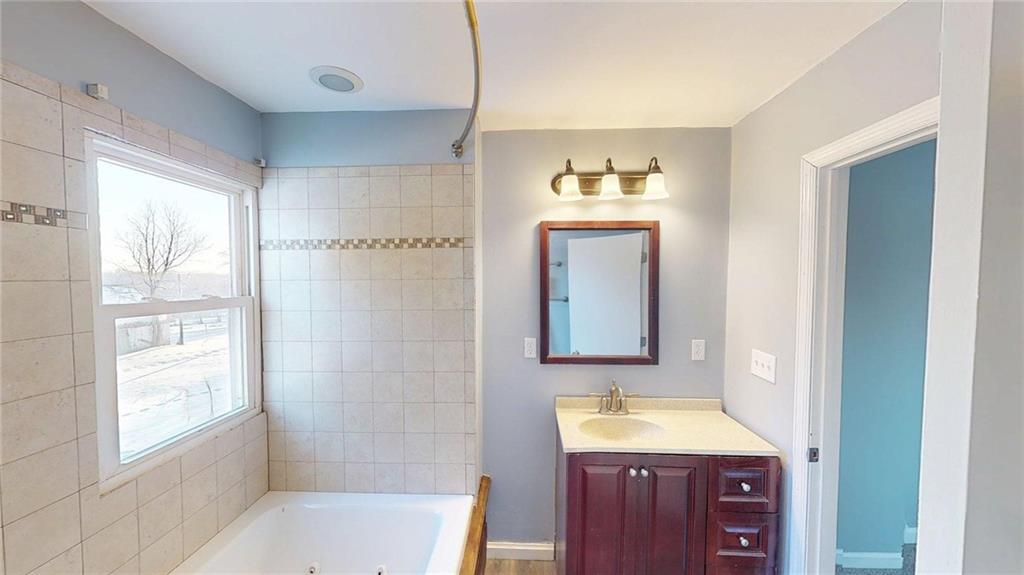 188 Reiber Road Renfrew, PA 16053 - Photo 17 of 38 a bathroom with a tub sink and a mirror