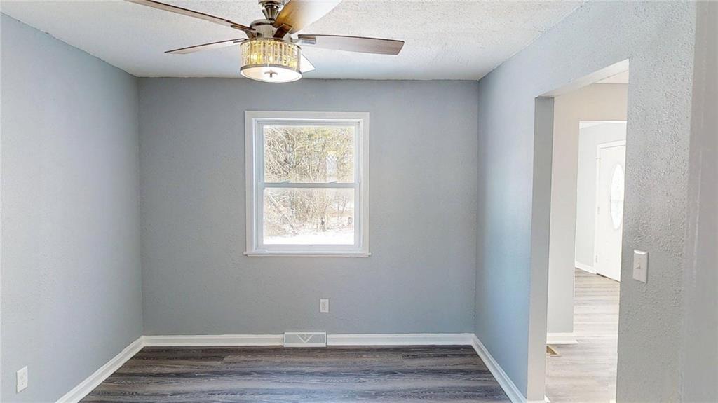 188 Reiber Road Renfrew, PA 16053 - Photo 6 of 38 an empty room with wooden floor fan and window