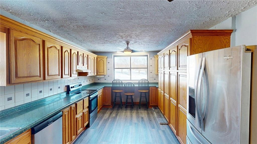 188 Reiber Road Renfrew, PA 16053 - Photo 10 of 38 a kitchen with granite countertop a refrigerator a sink dishwasher stove and oven