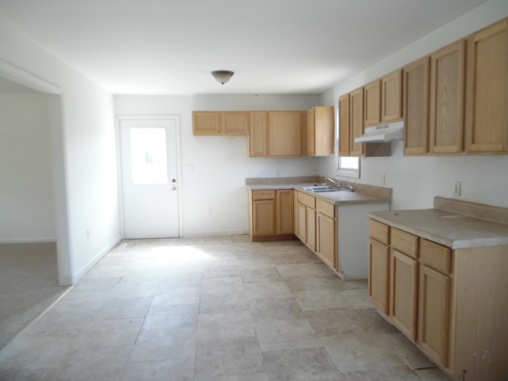 760 Lea Port Road Verona, VA 24482 - Photo 5 of 10 a kitchen with stainless steel appliances granite countertop a sink stove and cabinets