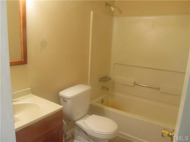 1141 Hickory Crossroads Road Kenly, NC 27542 - Photo 14 of 17 Bathroom with new vinyl and new paint.