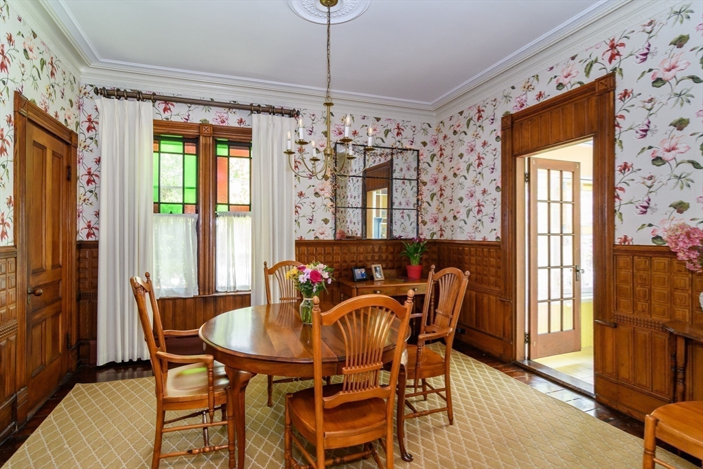 8 Charles Street Natick, MA 01760 - Photo 11 of 36 a dining room with furniture a chandelier and wooden floor