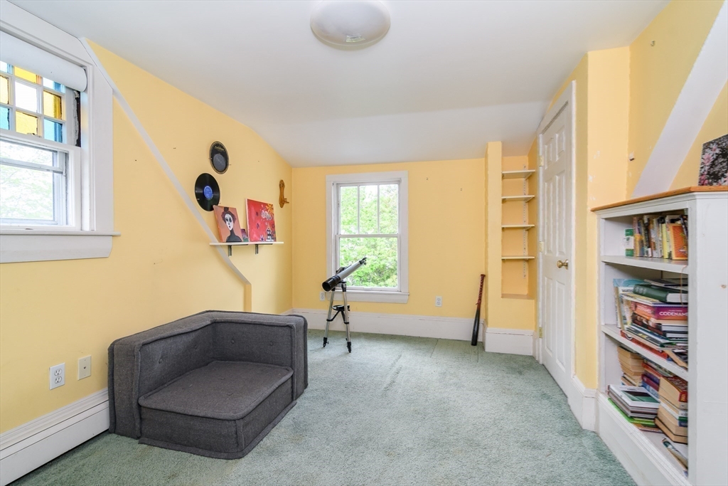 8 Charles Street Natick, MA 01760 - Photo 22 of 36 a living room with furniture and a window
