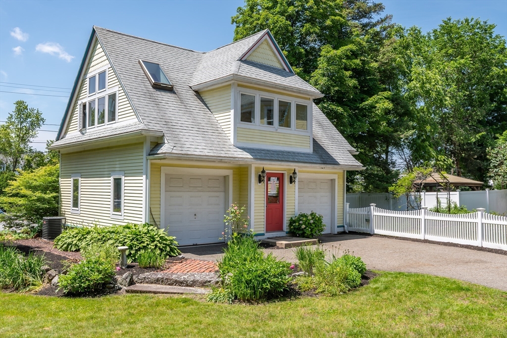 8 Charles Street Natick, MA 01760 - Photo 24 of 36 a front view of a house with a yard