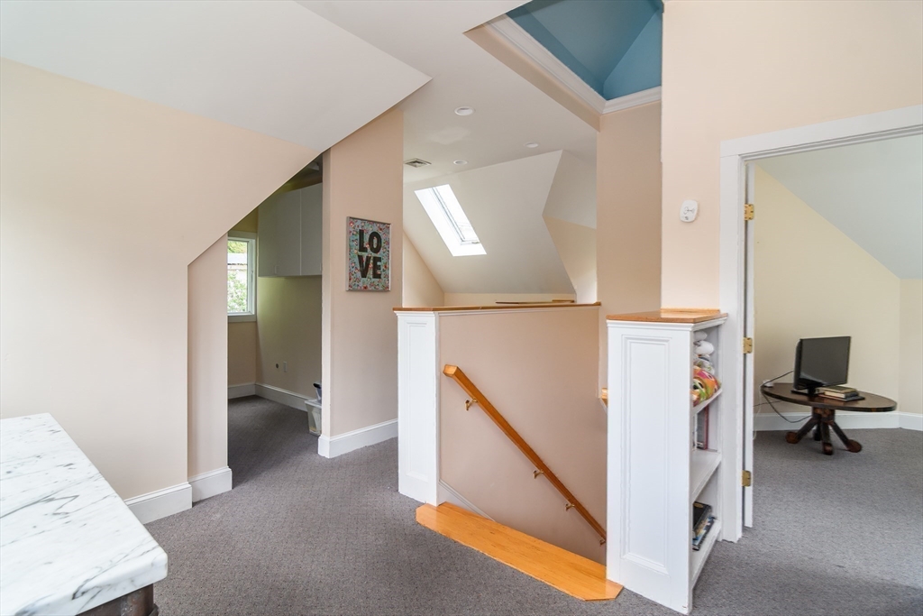 8 Charles Street Natick, MA 01760 - Photo 26 of 36 a view of hallway with furniture and a living room