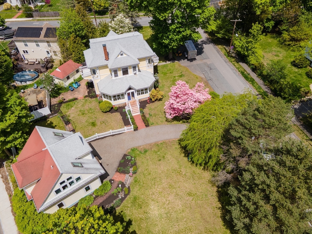 8 Charles Street Natick, MA 01760 - Photo 3 of 36 an aerial view of a house with a yard and pool