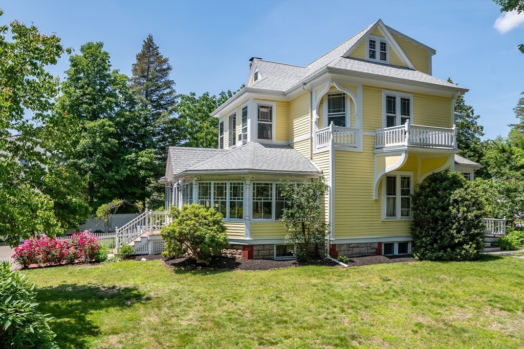 8 Charles Street Natick, MA 01760 - Photo 34 of 36 a front view of a house with a garden