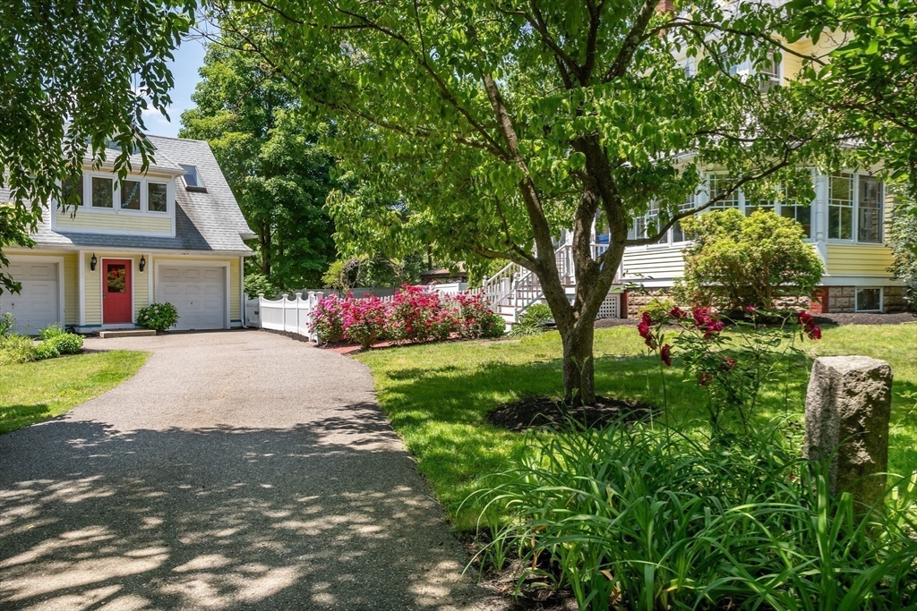 8 Charles Street Natick, MA 01760 - Photo 35 of 36 a front view of a house with a yard