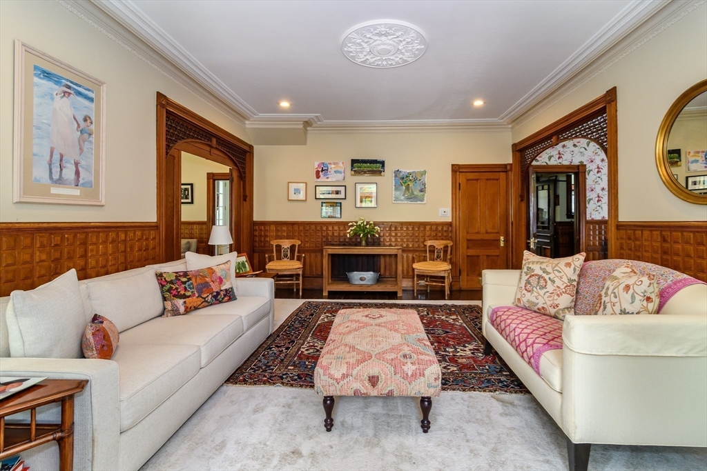 8 Charles Street Natick, MA 01760 - Photo 7 of 36 a living room with furniture and a fireplace